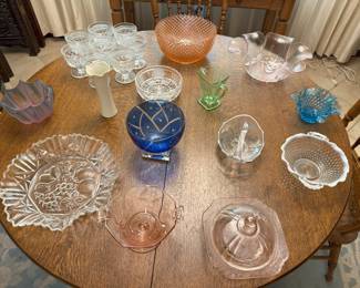 We have a lovely assortment of different kinds of glass. Note the orange dish at the top. It is the Miss America pattern produced by Hocking Glass Company, from 1935-1938.