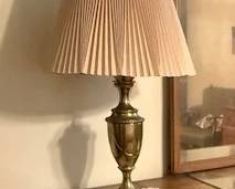 This is a lovely lamp with a brass base.