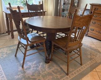 The table may be sold separately or as a set with four matching chairs.