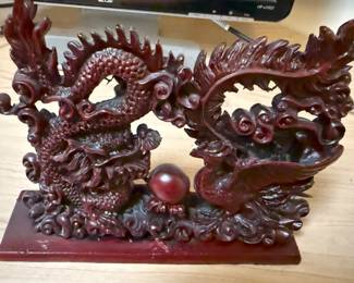 This is an interesting and intricate Asian carving of a dragon.