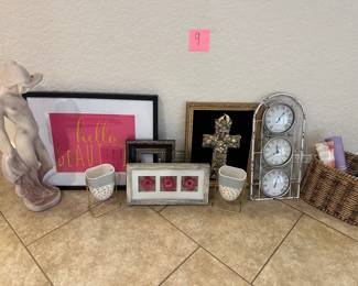Lot 9 framed art, jeweled, cross clock, and statue of Lady.  $55