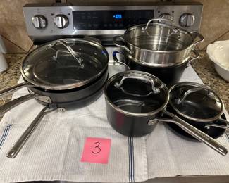 Lot 3 . Set of KitchenAid pans with one Kirkland piece.  $50