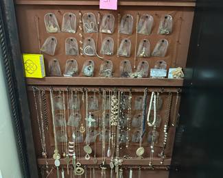 Lot 51    Lot of jewelry necklaces rings, earrings, jewelry cabinet, not included. $55