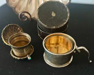 Antique collapsible travel cups with cases (Mark Cross, R)