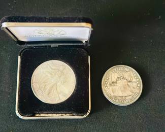 Silver dollar and silver commemorative coin