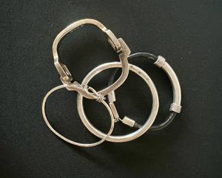 Sterling silver bangles and bracelets, including modernist piece by Tane Mexico City (top L)