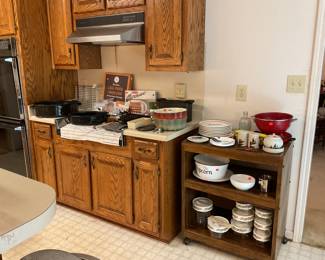 Microwave cabinet, “Spice of Life” storage jars,cookware