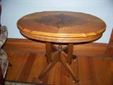 Oval walnut parlor table with inlay. Circa 1880-1890.