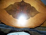 Top of oval walnut inlay parlor table.