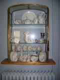 Brass/glass display case. Japan kitchen pieces, ruby flash, custard glass, and bakelite bird napkin ring.