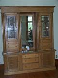 Quartersawn oak huge buffet with beveled cut glass doors and center beveled mirror. Circa 1920.