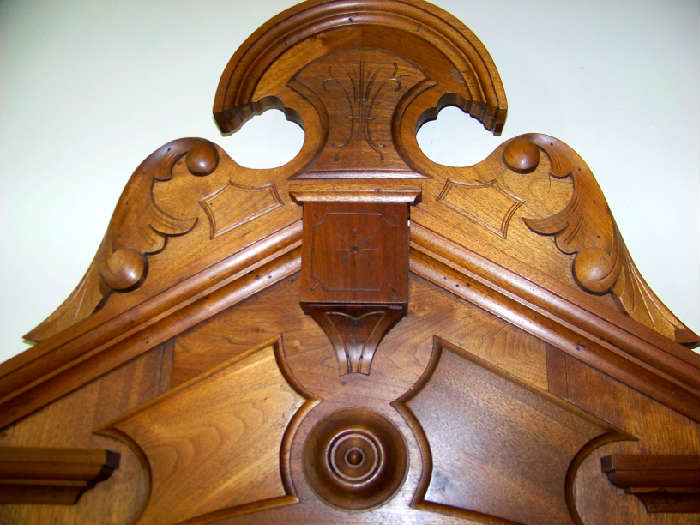 Close up of top of walnut carving.