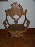 Intricate detail to this beautiful oak saddle chair.