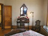 Walnut small desk with matching caned chair and caned rocking chair. Desk has mother of pearl pulls. Circa 1920. Fine quality. Was told that this set was out of the hormel home.
Mirror above is also for sale.
