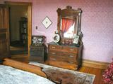 Walnut eastlake dresser with beveled mirror and marble top.