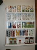 Shelf with highly colorful and collectible swanky swigs (Kraft cheese spread came in these). Several very rare ones. Many colorful 1940-1950's kitchen tumblers and glass racks.