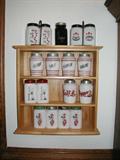 Shelf with milk glass range sets...hundreds more with spice sets, grease jars, etc. from 1940-1950's.
