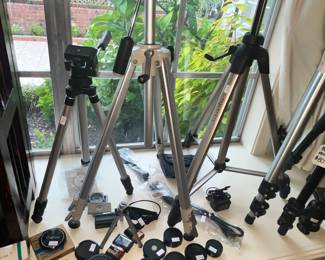 LOTS OF TRIPODS & OTHER CAMERA ITEMS