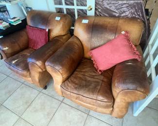 PAIR OF "VERY BROKE-IN" LEATHER CHAIRS & OTTOMAN
