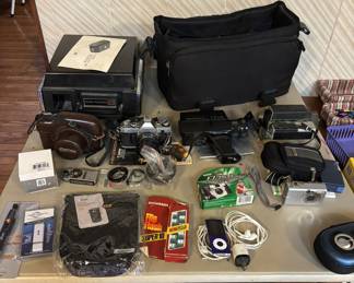 Vintage cameras and video equipment; Canon 35 mm; 8mm video; Apple ipod nano; VHS camcorder