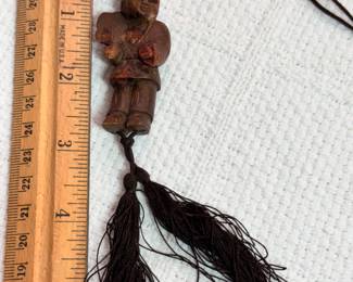 Wooden carved man pendant