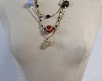 Interesting beaded necklace representing planets of our Sun