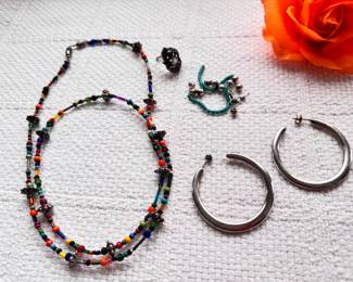 Silver hoop style earrings and colorful glass bead necklace and more