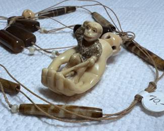 Unique carved monkey in hand pendant, new