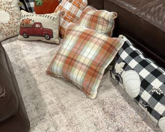 A large assortment of decorative pillows