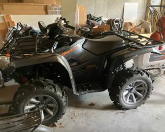 ATV with plow on the front of it