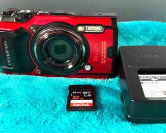 Olympus Tough camera 
Working condition,  charger, 2 batteries camera card, wrist carrier