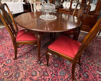 Round drop leaf dining table with 4 chairs