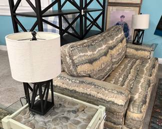 Unique end tables with river rock tops, modern black lamps, rustic pattern couch