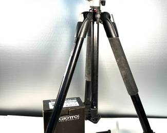 Many tripods of varying weights with accessories 