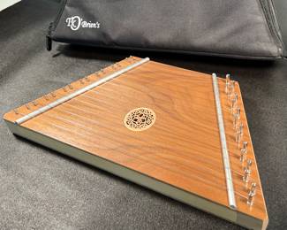 T.K. O’Brien’s wooden lap harp with inlay
