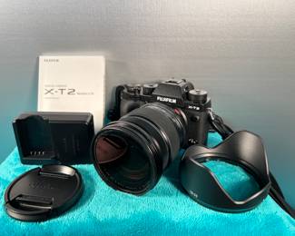 Photography equipment from prominent Lewisburg photographer, Connie Manchester, including a brand new Fuji digital mirrorless camera, 16-55 lens, charger, battery, lens hood, camera bag