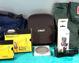 Camera bags, remote transmitter/receiver, many lenses and attachments 