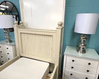 Trundle bed, bedside tables and modern silvertone lamps