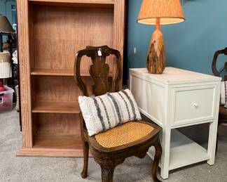 Bookcase/tv console, pair of ornate cane bottom
chairs, white filing cabinet, many nice pillows