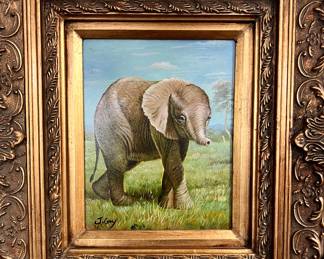 Baby elephant in ornate frame