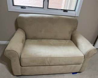 LIKE NEW HIDE-A-BED COUCH. MATTRESS STILL IN PLASTIC