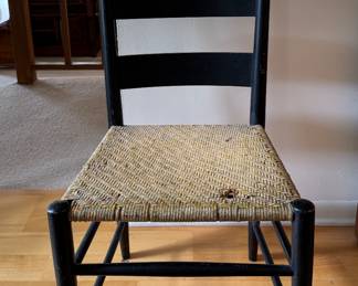 Antique Ebonized Wood Laddled Back Chair with Woven Cane Seat. Photo 1 of 5.