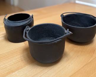 Vintage Cast Iron Pots. Photo 1 of 3.