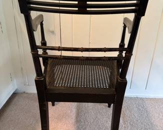 Antique Ebonized Wood Regency Style Arm Chair with Parcel Gilt Detailing and Cane Seat. Photo 7 of 8.
