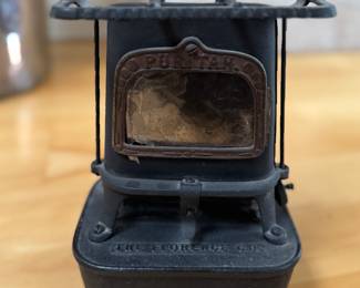 Vintage Florence Company Puritan Cast Iron Kerosene Stove (Sad Iron Stove) and Cast Iron Sad Iron. Photo 2 of 4.