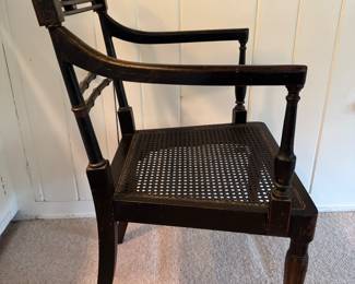 Antique Ebonized Wood Regency Style Arm Chair with Parcel Gilt Detailing and Cane Seat. Photo 3 of 8.