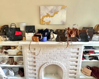Luxury Handbag Collection Displayed on White Fireplace Mantel – Designer Bags from Louis Vuitton, Chanel, and More