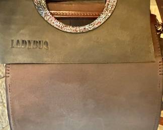 Ladybuq Handcrafted Leather Logo – Authentic Embossed Mark on Artisan Designer Bag