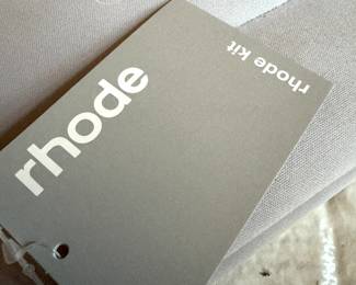 Rhode Brand Tag and Embossed Logo Detail – Authentic Designer Handbag Label Close-Up