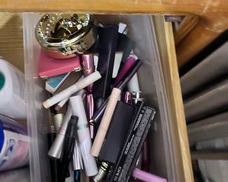 Bin filled entirely with both designer and drugstore makeup